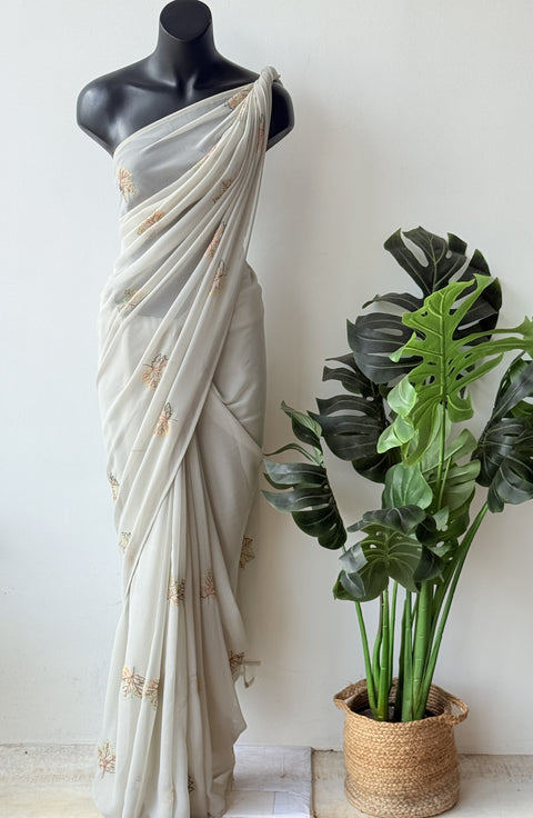 Pastel green maple leaf emb georgette saree