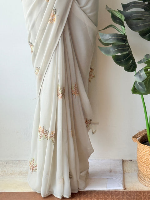 Pastel green maple leaf emb georgette saree