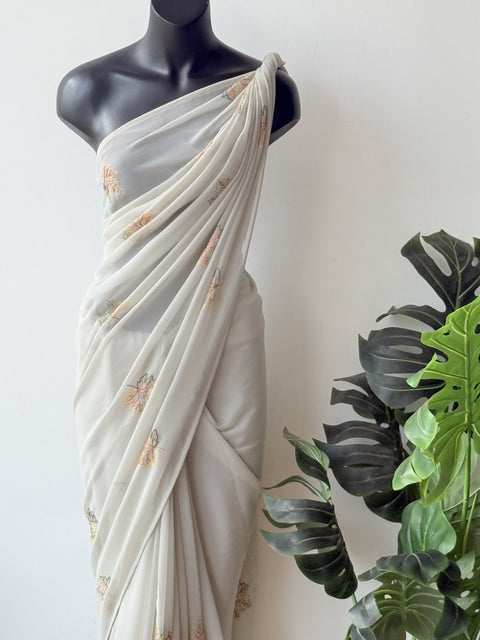 Pastel green maple leaf emb georgette saree
