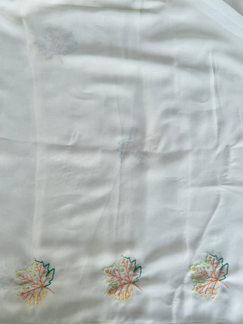 Pastel green maple leaf emb georgette saree