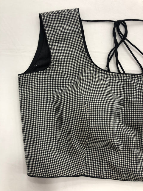 Small checked sleeveless blouse