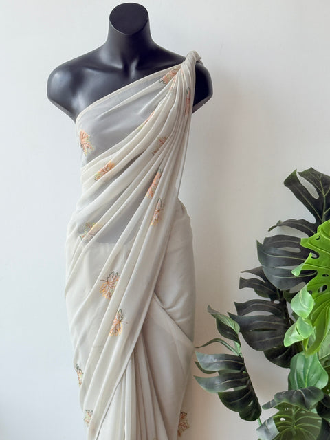 Pastel green maple leaf emb georgette saree