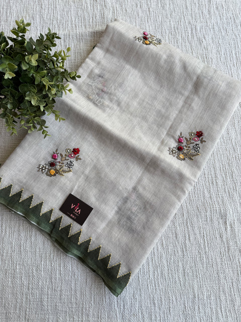 Hand emb Linen saree with printed blouse