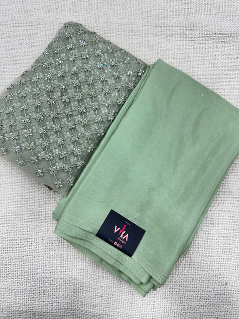 Light green satin crepe saree with blouse